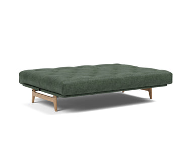 Aslak 140 sovesofa med Soft Spring madras i 281 Avella Pine Green, slået ud til seng