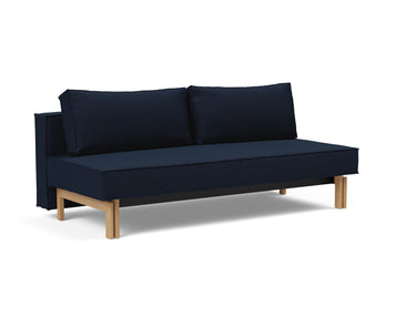 Sly Wood sovesofa i 528 Mixed Dance Blue, set skråt forfra
