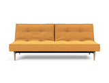 Splitback Styletto Light Wood sovesofa i 536 Bouclé Ochre, set forfra
