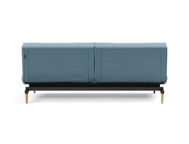 Splitback Styletto Light Wood sovesofa i 525 Mixed Dance Light Blue, set bagfra
