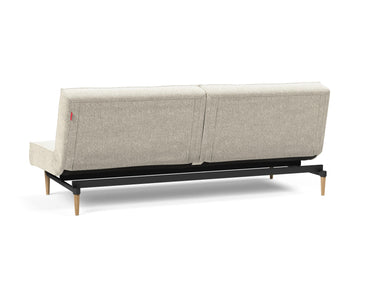 Splitback Styletto Light Wood sovesofa i 357 Taura Off White, set skråt bagfra