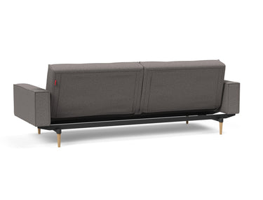 Splitback Styletto Light Wood sovesofa med armlæn i 521 Mixed Dance Grey, set skråt bagfra