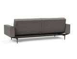 Splitback Styletto Dark Wood sovesofa med armlæn i 521 Mixed Dance Grey, set skråt bagfra