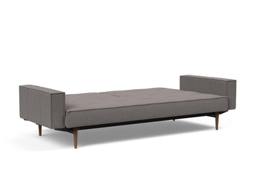 Splitback Styletto Dark Wood sovesofa med armlæn i 521 Mixed Dance Grey, slået ud til seng