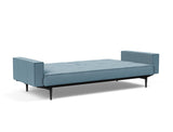 Splitback Styletto Black Wood sovesofa med armlæn i 525 Mixed Dance Light Blue, slået ud til seng