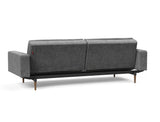 Dublexo Styletto Dark Wood sovesofa med armlæn i 563 Twist Charcoal, set skråt bagfra