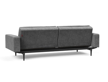 Dublexo Styletto Black Wood sovesofa med armlæn i 563 Twist Charcoal, set skråt bagfra