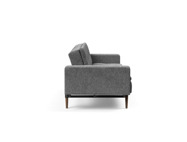 Dublexo Styletto Dark Wood sovesofa med armlæn i 563 Twist Charcoal, set fra siden