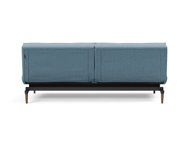 Splitback Styletto Dark Wood sovesofa i 525 Mixed Dance Light Blue, set bagfra