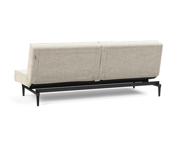 Splitback Styletto Black Wood sovesofa i 357 Taura Off White, set skråt bagfra