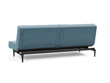 Splitback Styletto Black Wood sovesofa i 525 Mixed Dance Light Blue, set skråt bagfra
