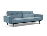 Splitback Styletto Black Wood sovesofa med armlæn i 525 Mixed Dance Light Blue, med den ene ryghalvdel lænet tilbage