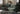 Akello sovesofa med armlæn i 281 Avella Pine Green i en stue